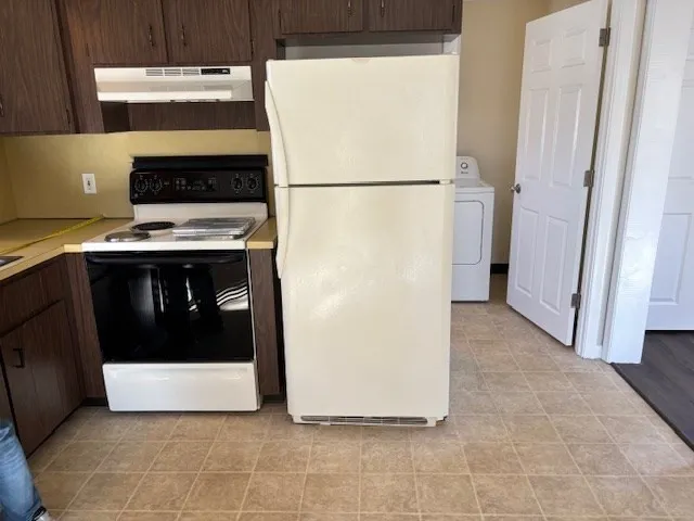 a view of kitchen with a stove top oven