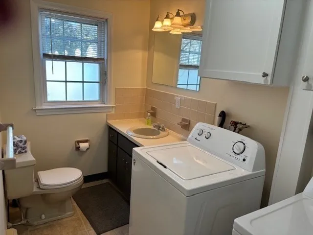 a utility room with dryer and washer