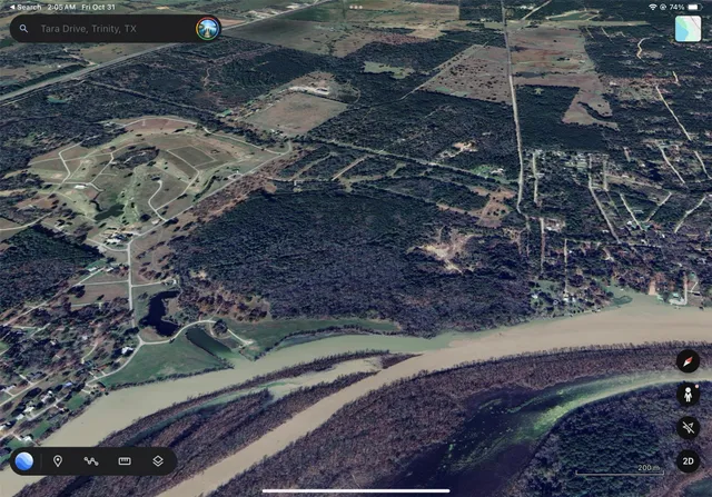 a view of a swimming pool and trees