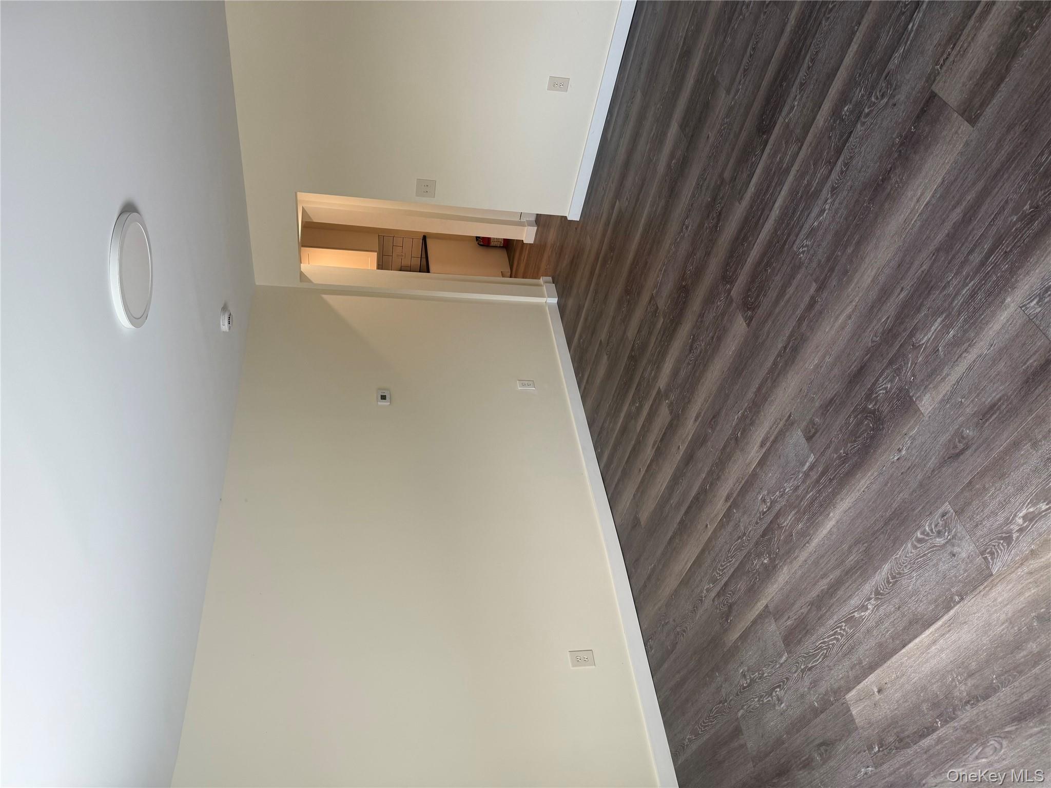 92 Wigsten Road, Unit 1 Pleasant Valley, NY 12569 - Photo 2 of 8 a view of empty room with wooden floor