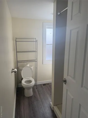 a bathroom with a toilet and a sink