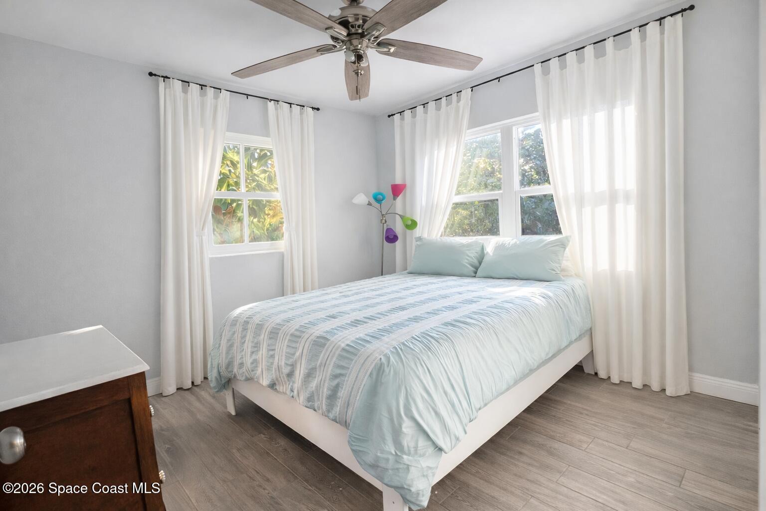120 Boca Ciega Road Cocoa Beach, FL 32931 - Photo 13 of 23 a bedroom with a bed and a window