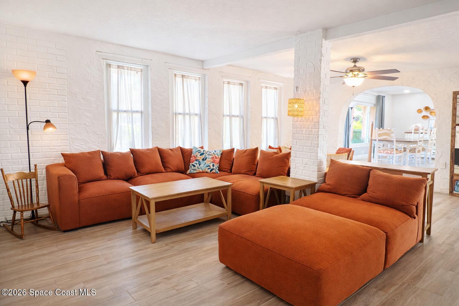 120 Boca Ciega Road Cocoa Beach, FL 32931 - Photo 5 of 23 a living room with furniture and a large window