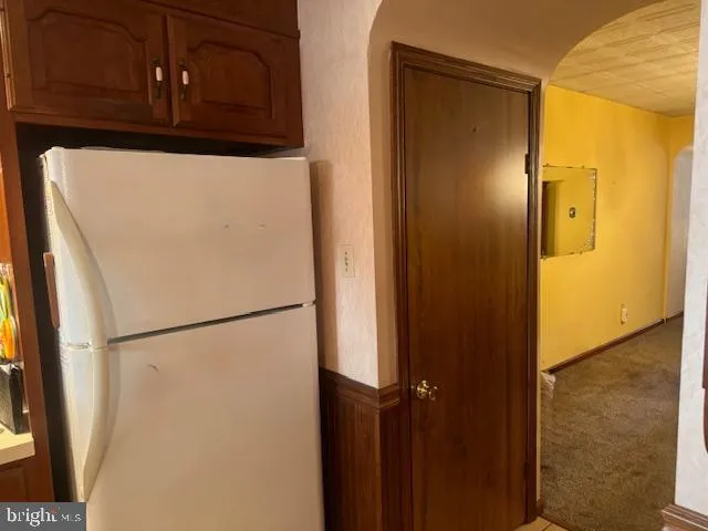 a close view of a refrigerator in kitchen and a refrigerator