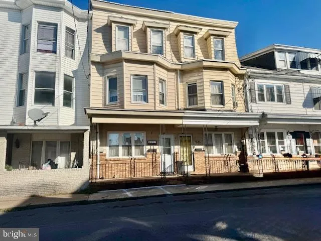 a front view of building with street