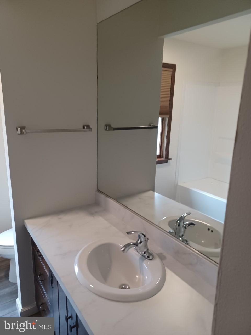 1525 Yardley Newtown Road, Unit 1 Morrisville, PA 19067 - Photo 11 of 14 a bathroom with a sink and a mirror