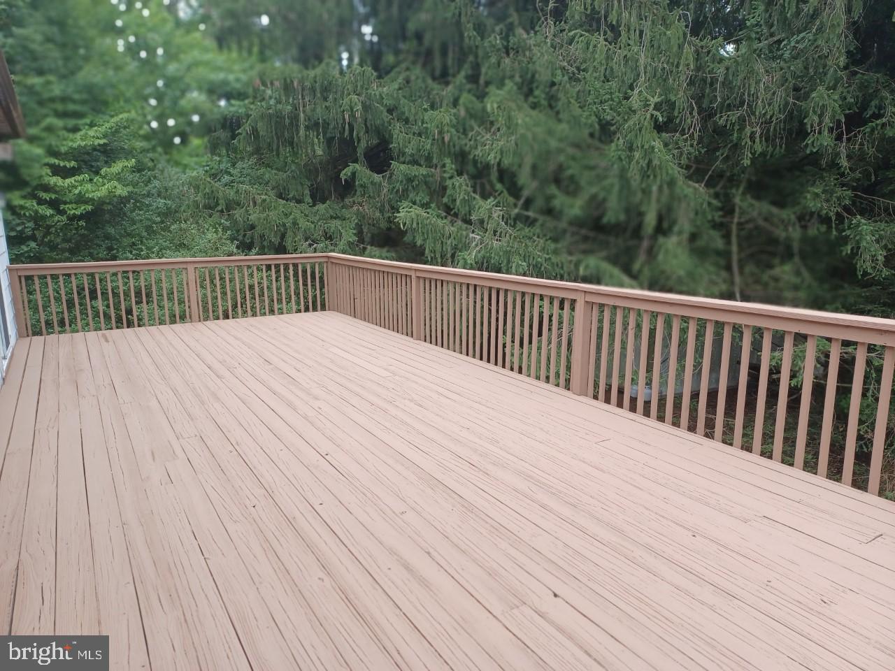 1525 Yardley Newtown Road, Unit 1 Morrisville, PA 19067 - Photo 14 of 14 a balcony with view of trees in the background