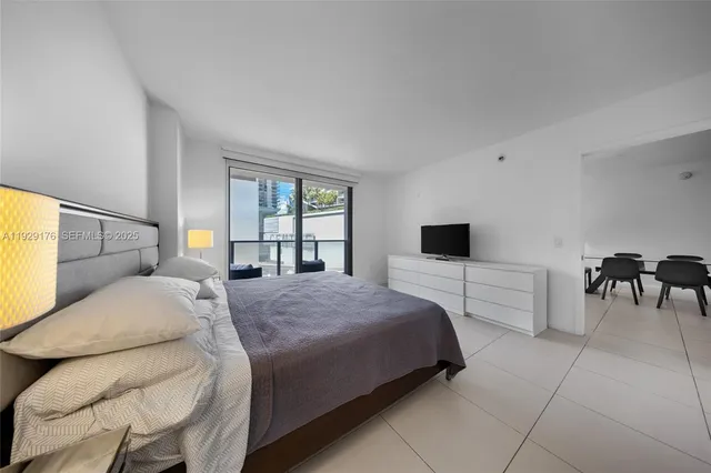 a bedroom with a bed and a table