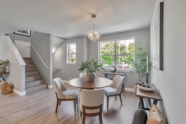 a dining room with furniture window wooden floor