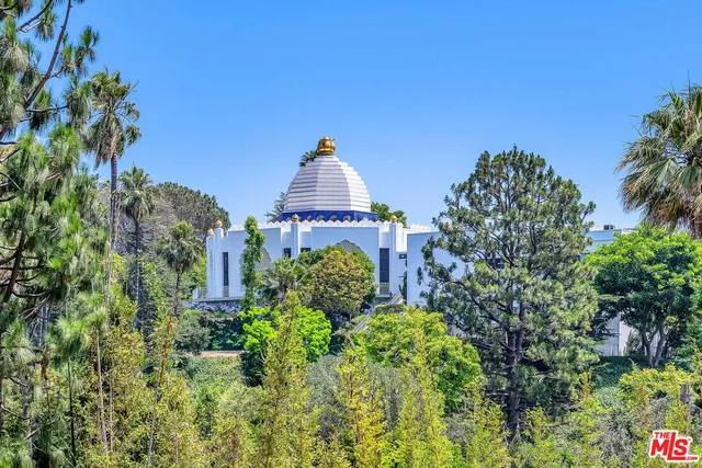 a view of a garden with a fountain