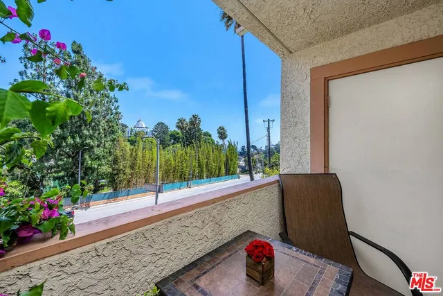 a view of a porch with seating space