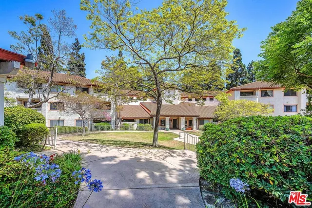 a view of a patio with a table and chairs