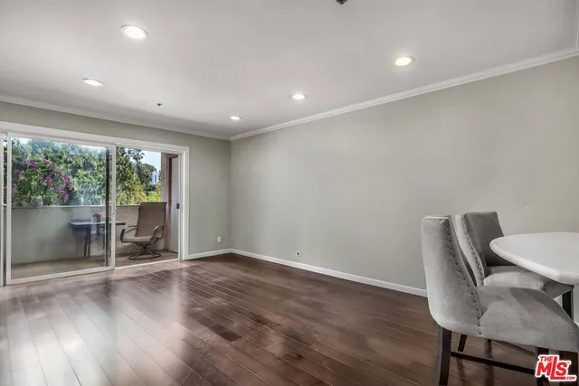 a view of a room with wooden floor and outdoor seating