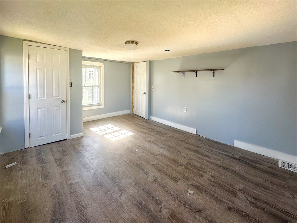 120 Hampden Street West Springfield, MA 01089 - Photo 14 of 21 an empty room with wooden floor and windows