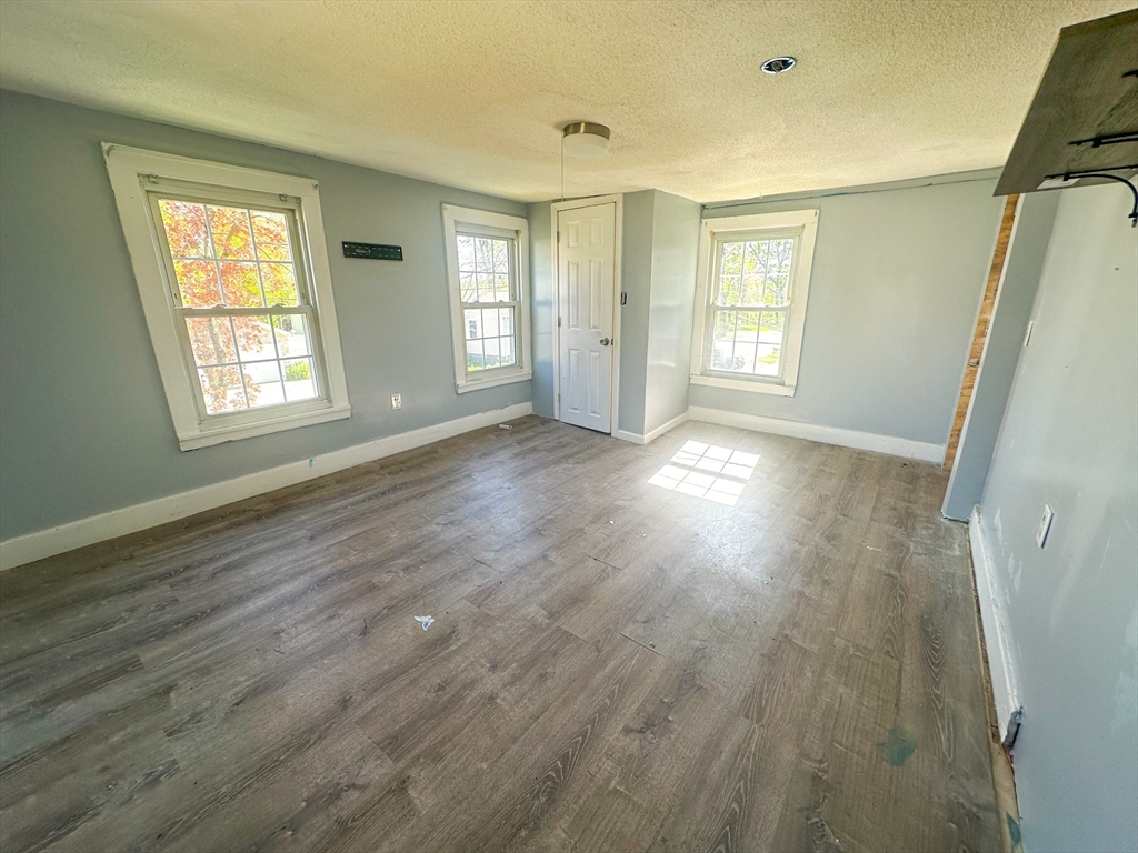 120 Hampden Street West Springfield, MA 01089 - Photo 15 of 21 a view of an empty room with wooden floor and a window