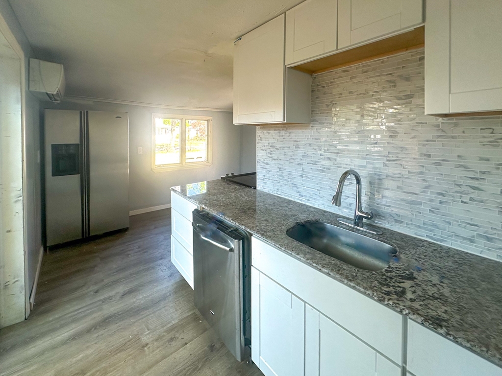 120 Hampden Street West Springfield, MA 01089 - Photo 20 of 21 a kitchen with stainless steel appliances granite countertop a sink stove and cabinets