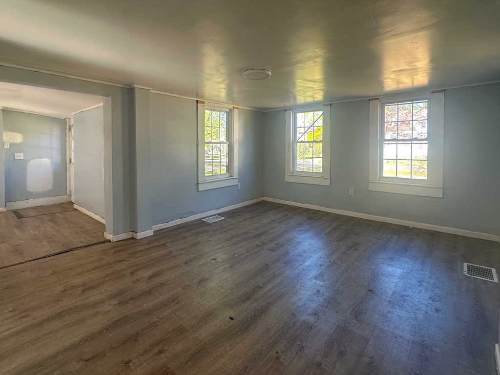 120 Hampden Street West Springfield, MA 01089 - Photo 5 of 21 a view of an empty room with wooden floor and a window