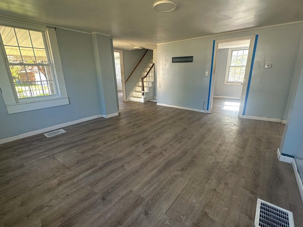120 Hampden Street West Springfield, MA 01089 - Photo 7 of 21 an empty room with wooden floor and windows