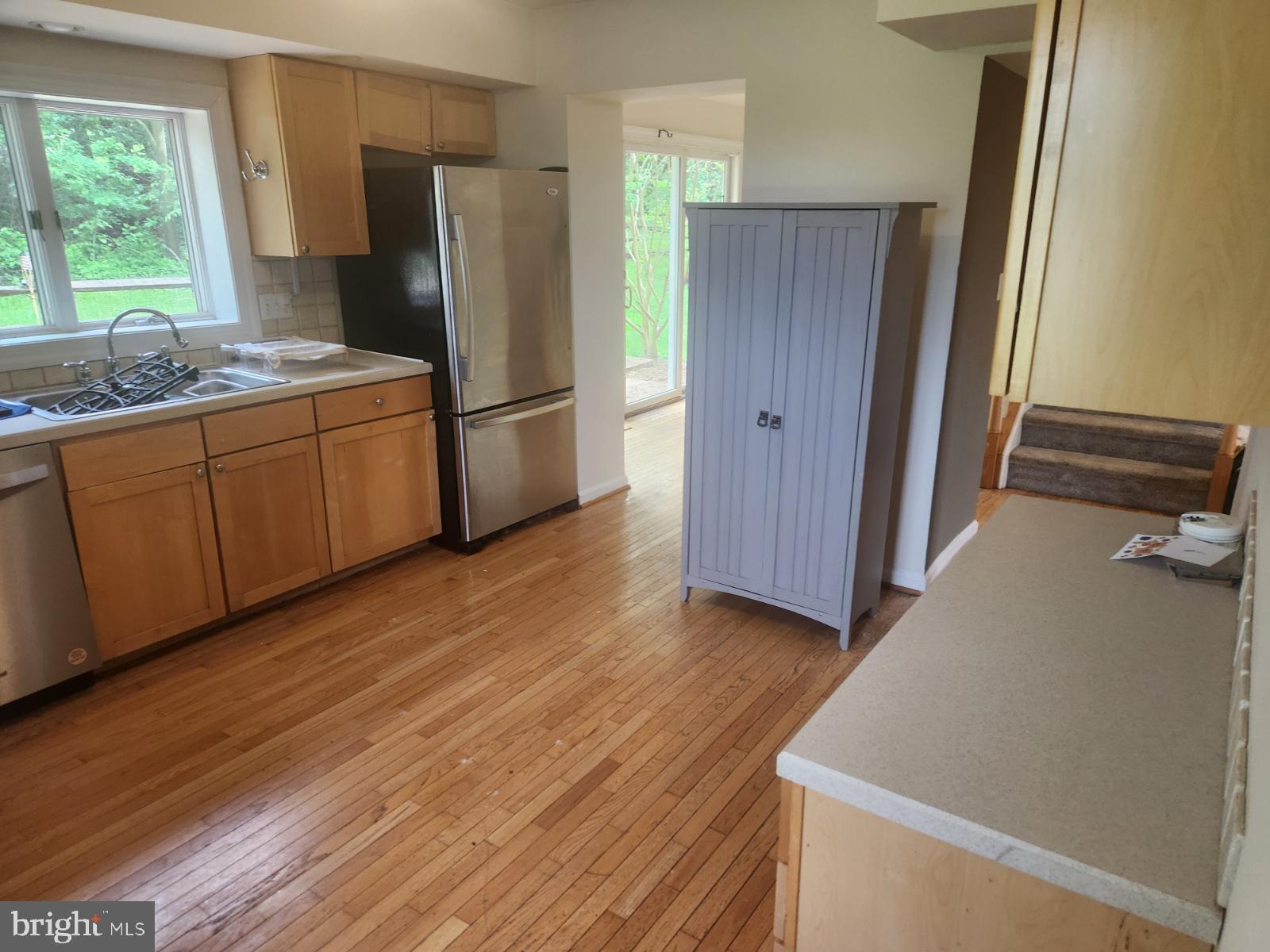 1507 Easton Road Warrington, PA 18976 - Photo 18 of 55 a kitchen with stainless steel appliances a refrigerator and wooden cabinets