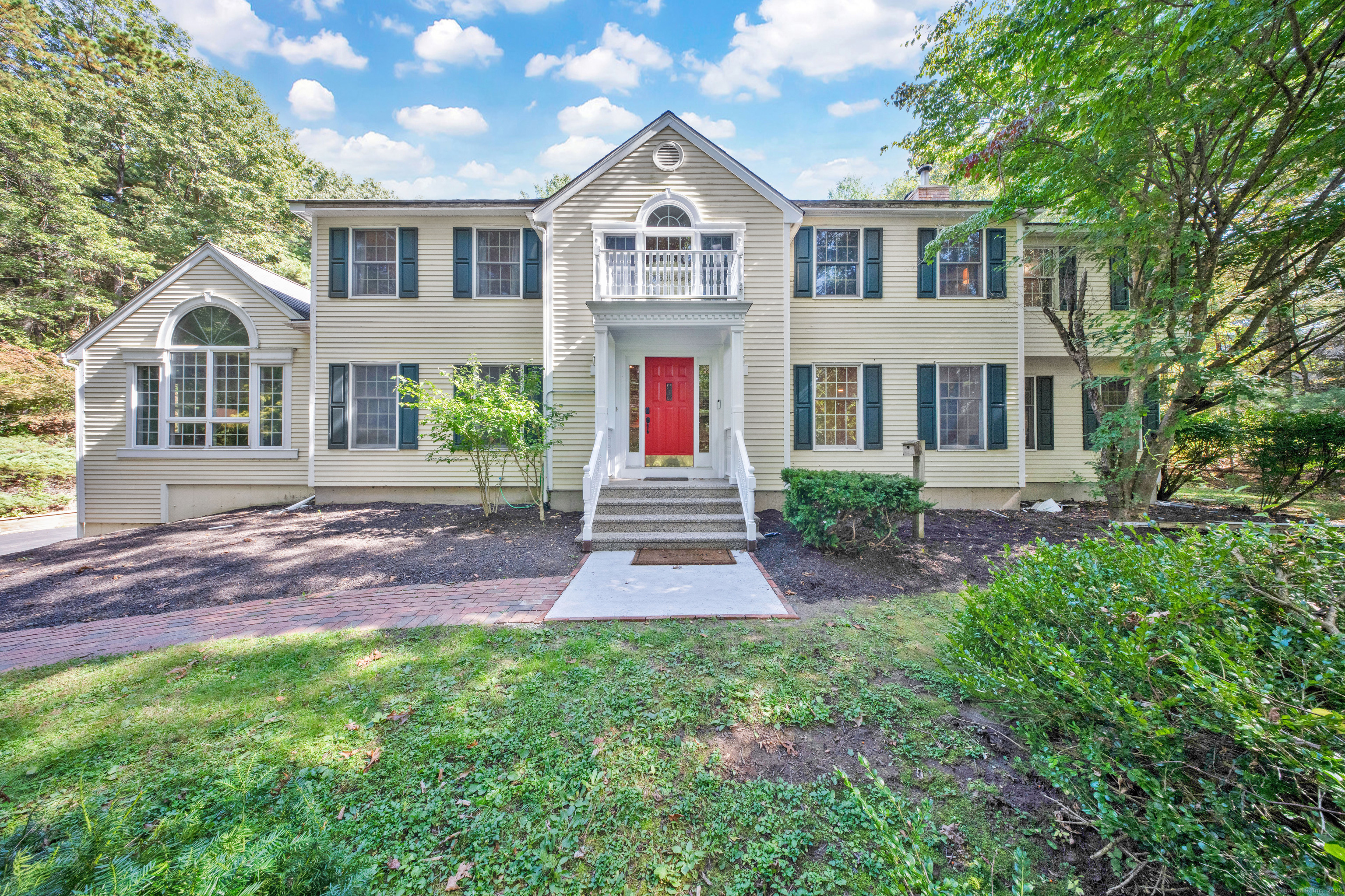 2 Pheasant Run Granby, CT 06060 - Photo 1 of 1 a front view of a house with a yard