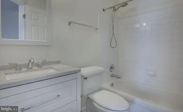 a bathroom with a sink toilet and vanity