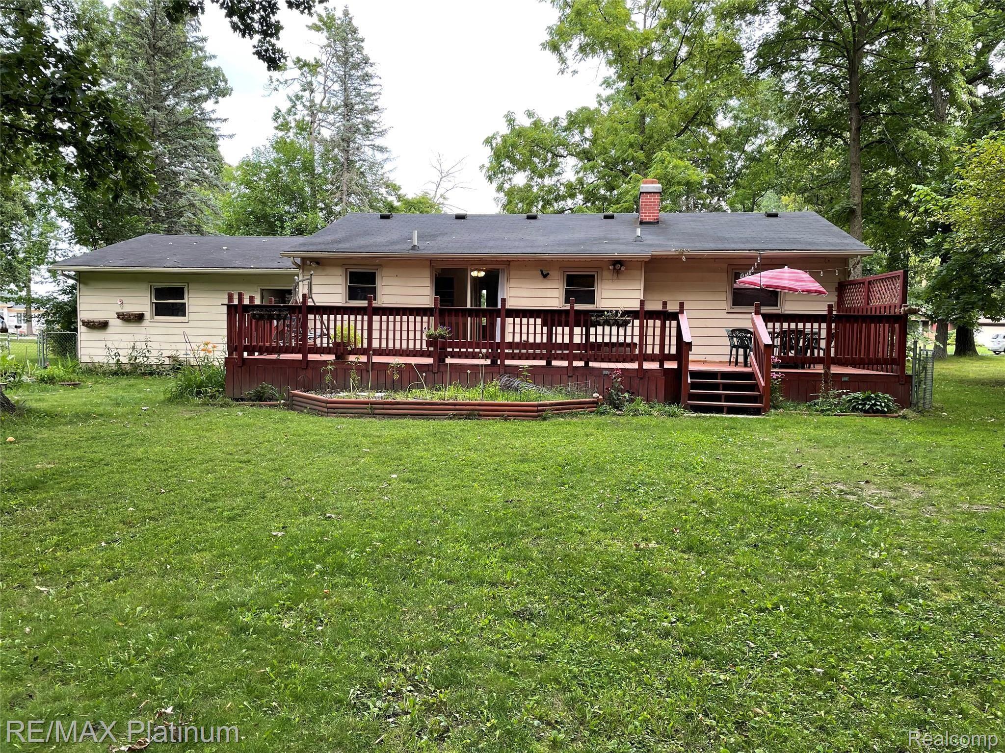13204 Torrey Road Fenton, MI 48430 - Photo 24 of 24 Rear View of Home with Extended Decking