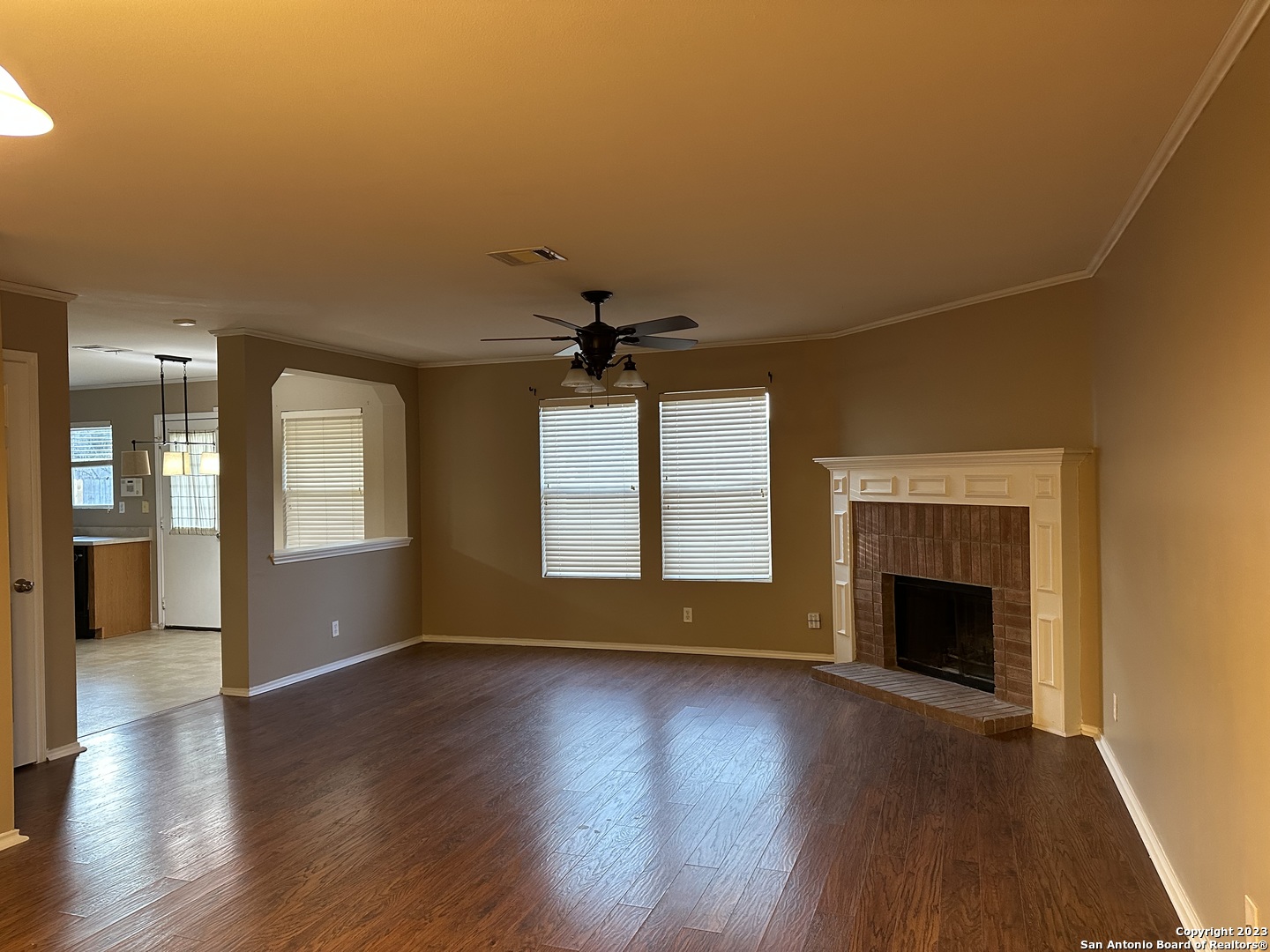 8019 Rio NIEBLA San Antonio, TX 78249 - Photo 5 of 16 an empty room with wooden floor and windows