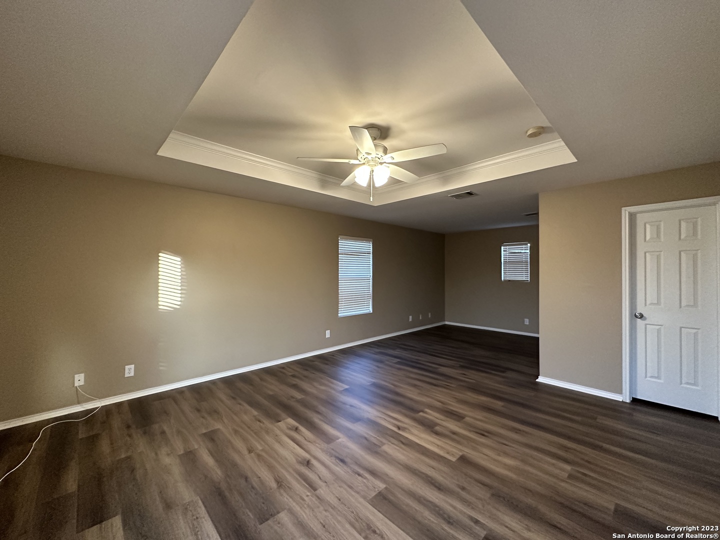 8019 Rio NIEBLA San Antonio, TX 78249 - Photo 7 of 16 an empty room with wooden floor and windows