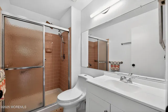 a bathroom with a sink toilet tub and shower