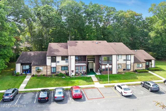 a view of a parked cars in front of a house