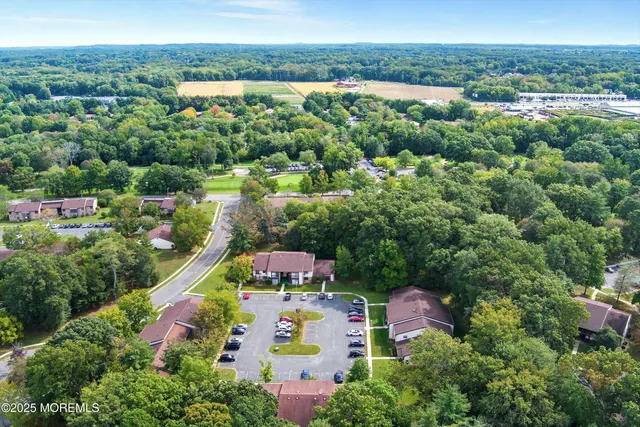 an aerial view of residential house with outdoor space and swimming pool