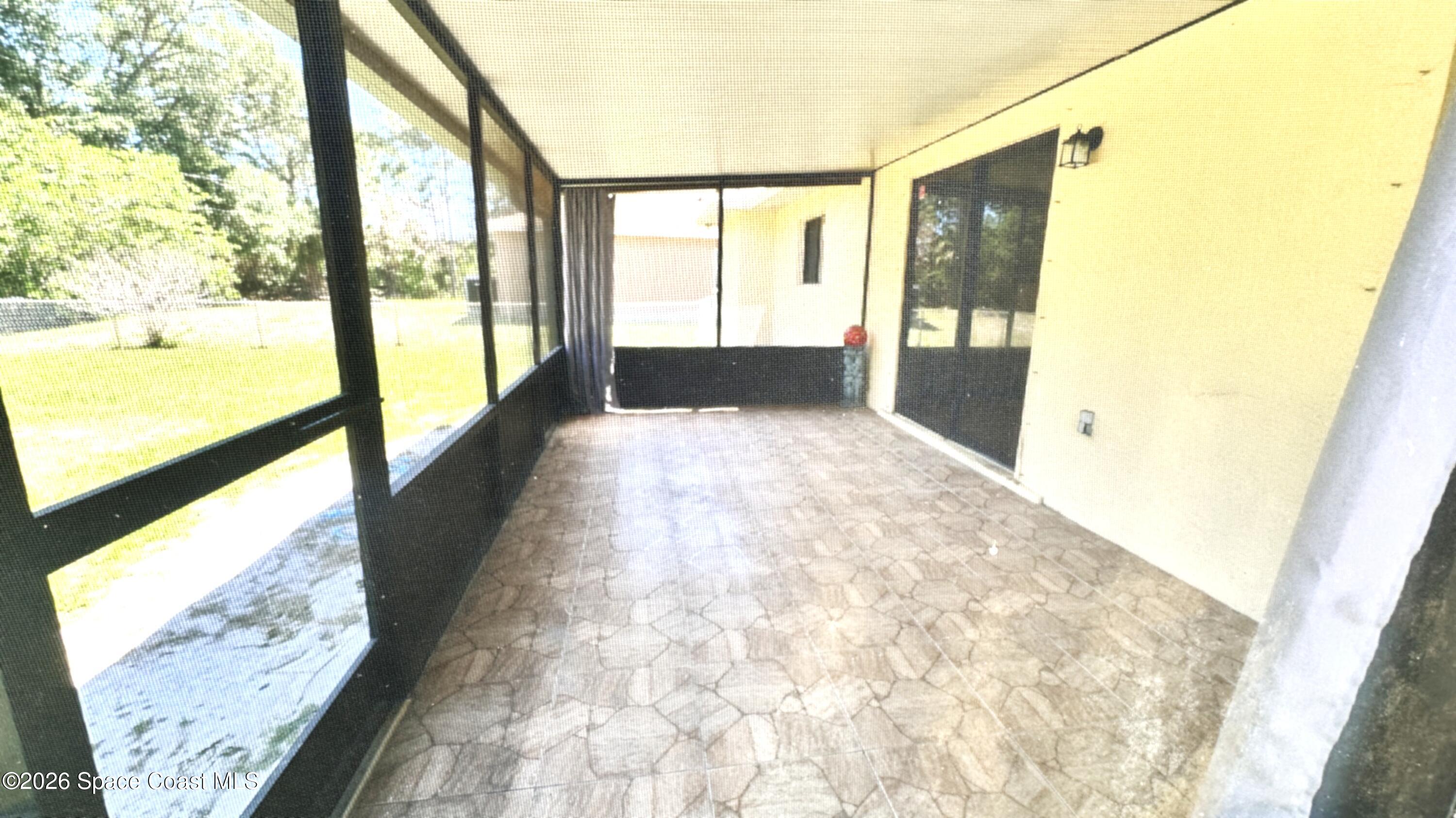 931 Commerce Road Southeast Palm Bay, FL 32909 - Photo 16 of 19 a view of hallway with furniture and a porch