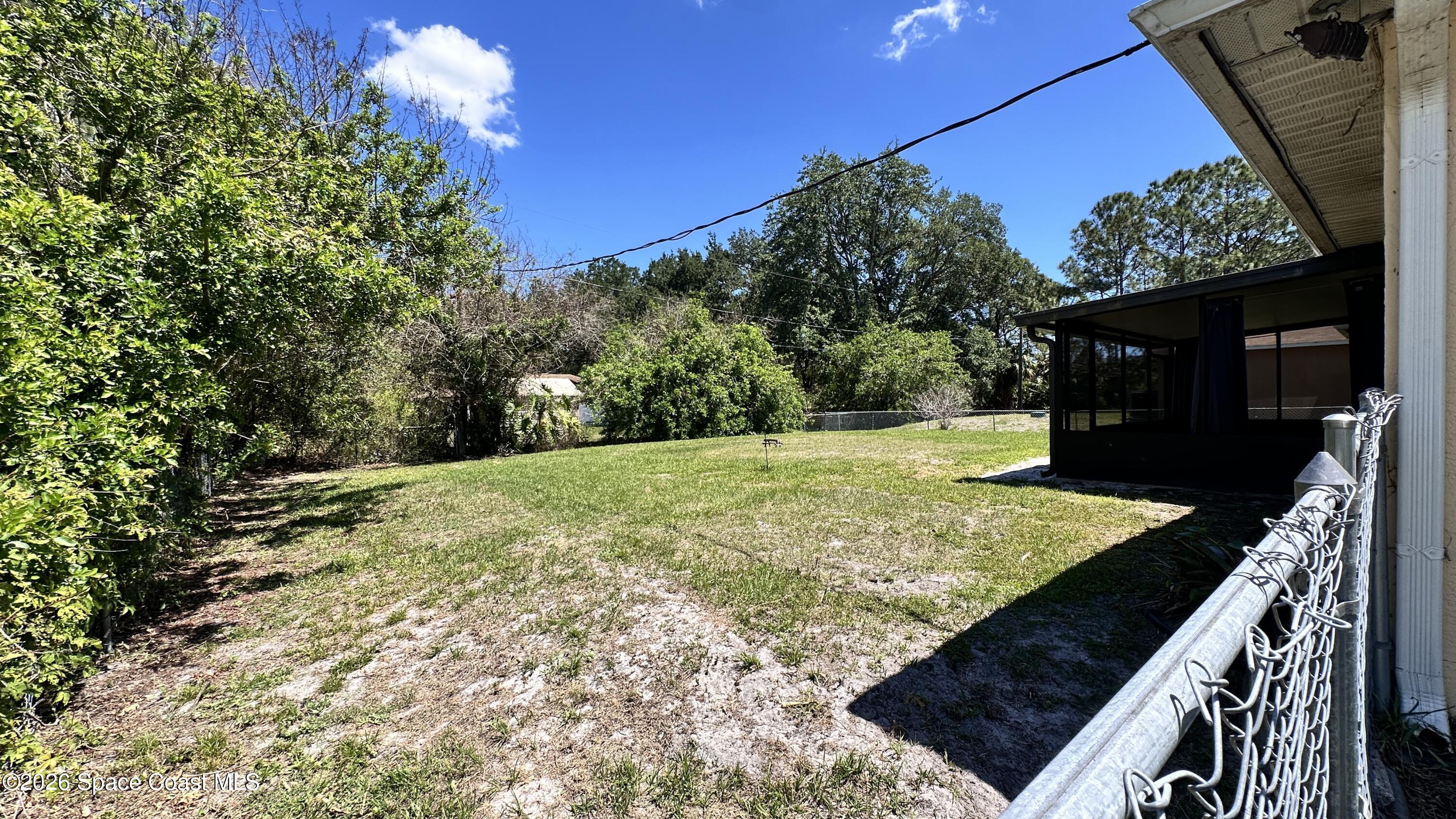 931 Commerce Road Southeast Palm Bay, FL 32909 - Photo 17 of 19 a view of a backyard