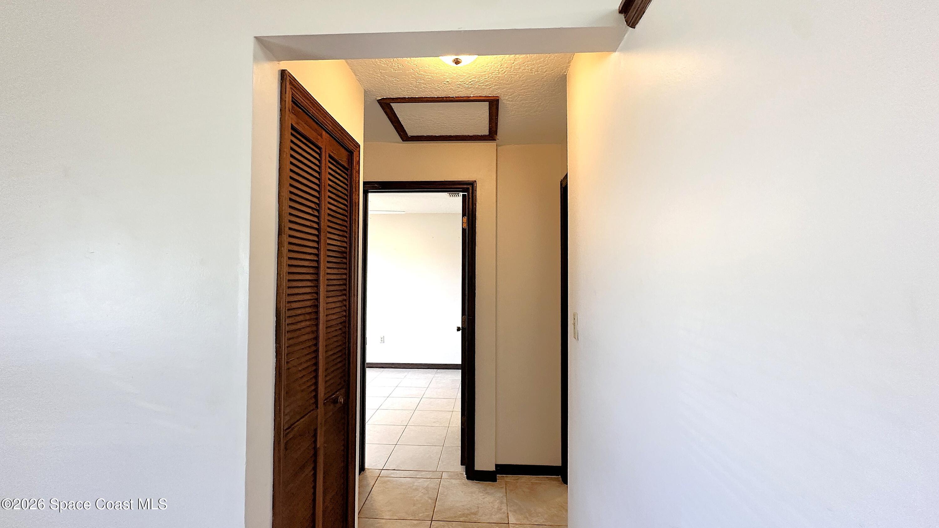 931 Commerce Road Southeast Palm Bay, FL 32909 - Photo 8 of 19 a view of a hallway with paintings on the wall