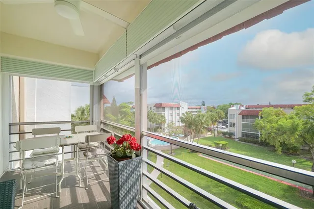 a living room filled with furniture and a potted plant