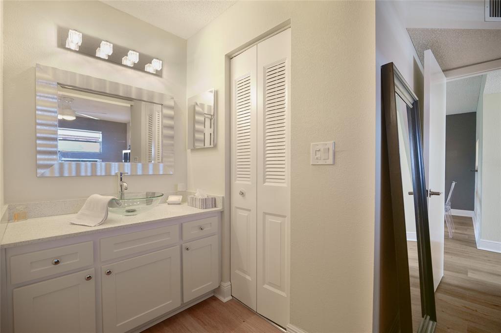 3531 Inverrary Drive, Unit 407 Lauderhill, FL 33319 - Photo 18 of 59 a spacious bathroom with a double vanity sink and mirror