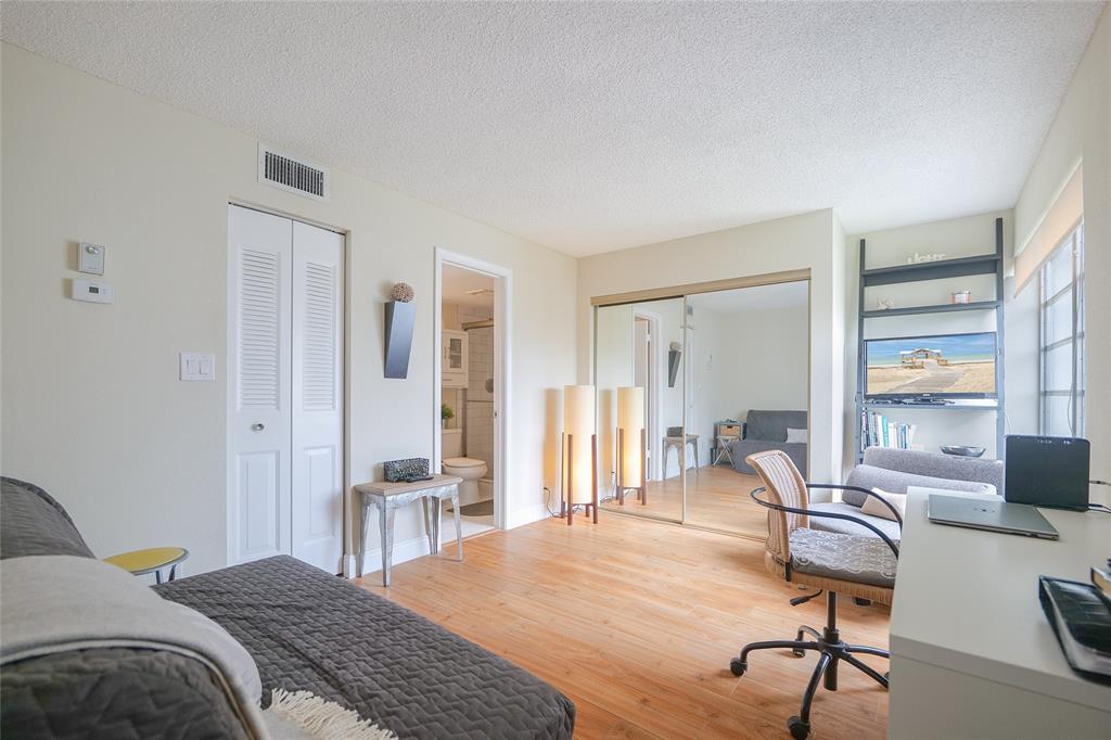 3531 Inverrary Drive, Unit 407 Lauderhill, FL 33319 - Photo 20 of 59 a bedroom with a bed and furniture