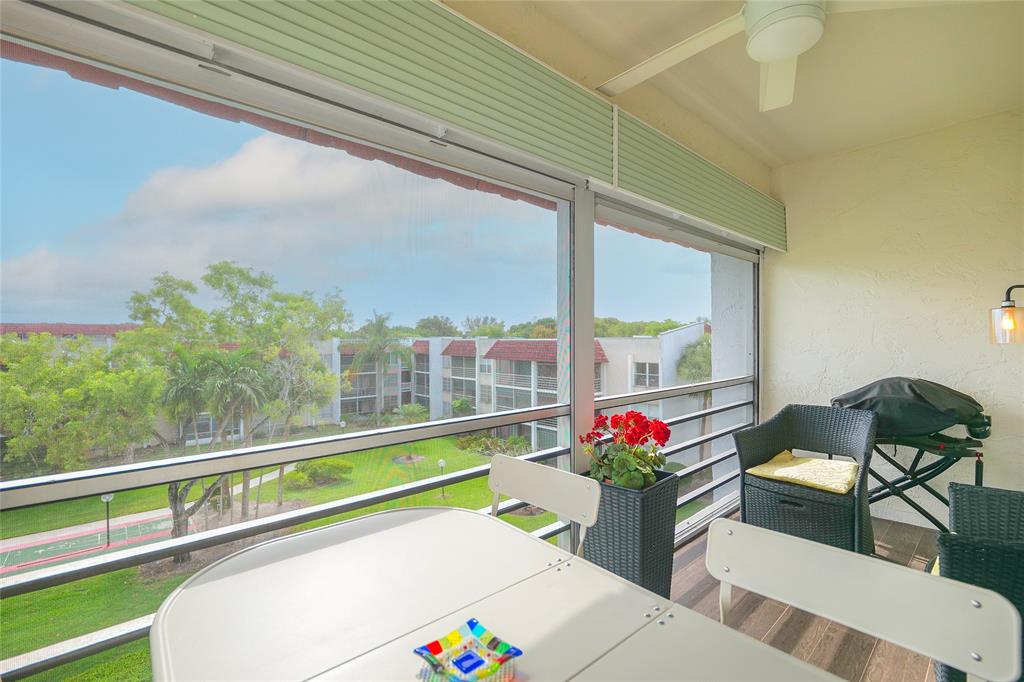 3531 Inverrary Drive, Unit 407 Lauderhill, FL 33319 - Photo 2 of 59 a living room filled with furniture and a potted plant
