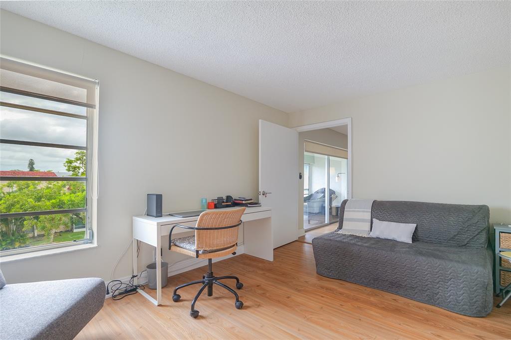 3531 Inverrary Drive, Unit 407 Lauderhill, FL 33319 - Photo 22 of 59 a living room with furniture and a window