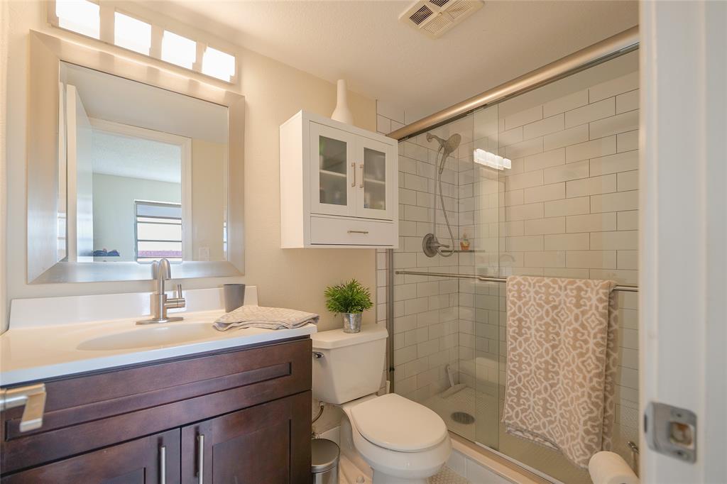 3531 Inverrary Drive, Unit 407 Lauderhill, FL 33319 - Photo 24 of 59 a bathroom with a sink a toilet and shower