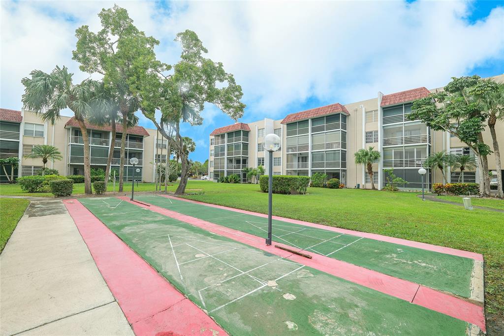 3531 Inverrary Drive, Unit 407 Lauderhill, FL 33319 - Photo 35 of 59 a view of a green field with palm trees