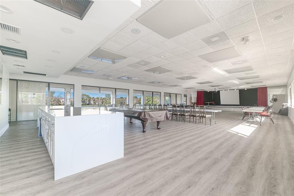 3531 Inverrary Drive, Unit 407 Lauderhill, FL 33319 - Photo 40 of 59 a living room with furniture and a table