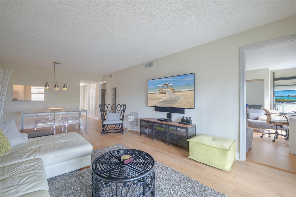 3531 Inverrary Drive, Unit 407 Lauderhill, FL 33319 - Photo 4 of 59 a living room with furniture and a flat screen tv