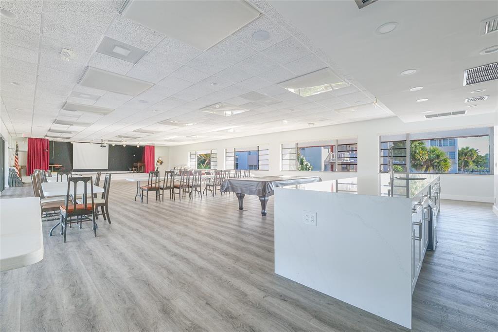 3531 Inverrary Drive, Unit 407 Lauderhill, FL 33319 - Photo 41 of 59 a living room with furniture and a wooden floor