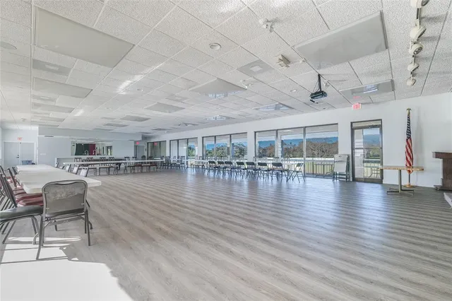 a view of a patio with a table and chairs