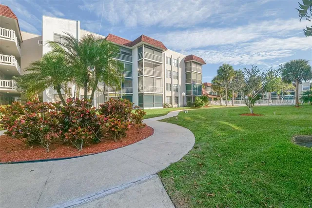a front view of a building with parking