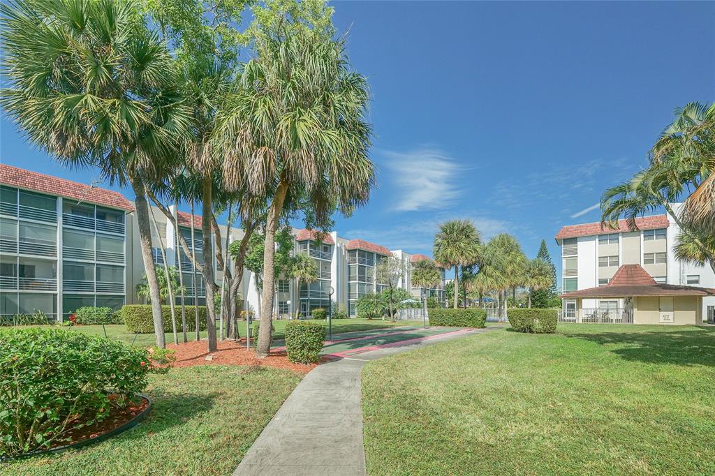 3531 Inverrary Drive, Unit 407 Lauderhill, FL 33319 - Photo 54 of 59 a front view of a house with a yard