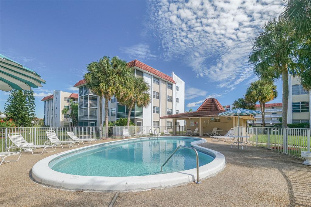 3531 Inverrary Drive, Unit 407 Lauderhill, FL 33319 - Photo 57 of 59 a view of outdoor space yard swimming pool and patio