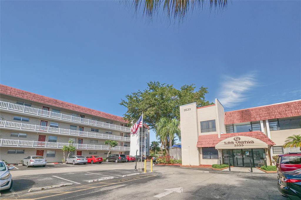 3531 Inverrary Drive, Unit 407 Lauderhill, FL 33319 - Photo 58 of 59 a front view of a building with parking