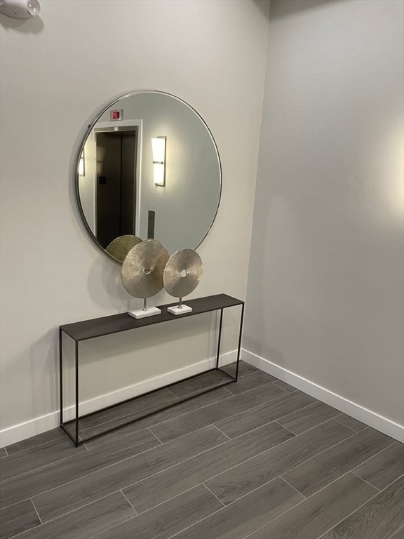 64 Market Street, Unit 303 Lynn, MA 01901 - Photo 12 of 12 a view of a livingroom with wooden floor